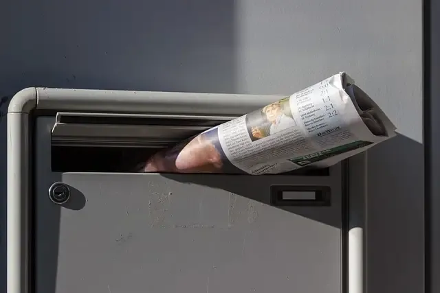 A newspaper in a mailbox